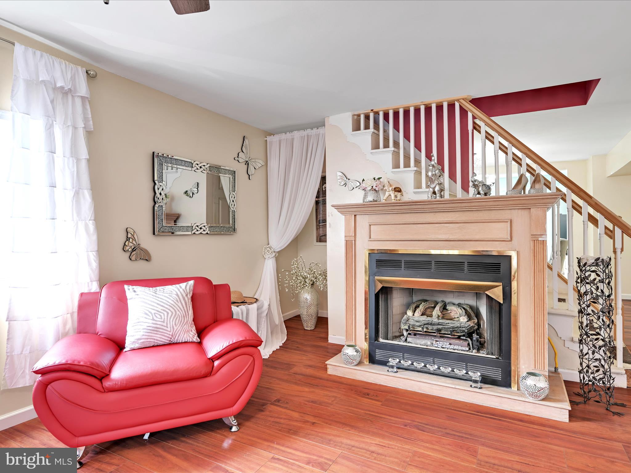125 West Washington Street Shenandoah, PA 17976 - Photo 11 of 29 a living room with furniture a flat screen tv and a fireplace