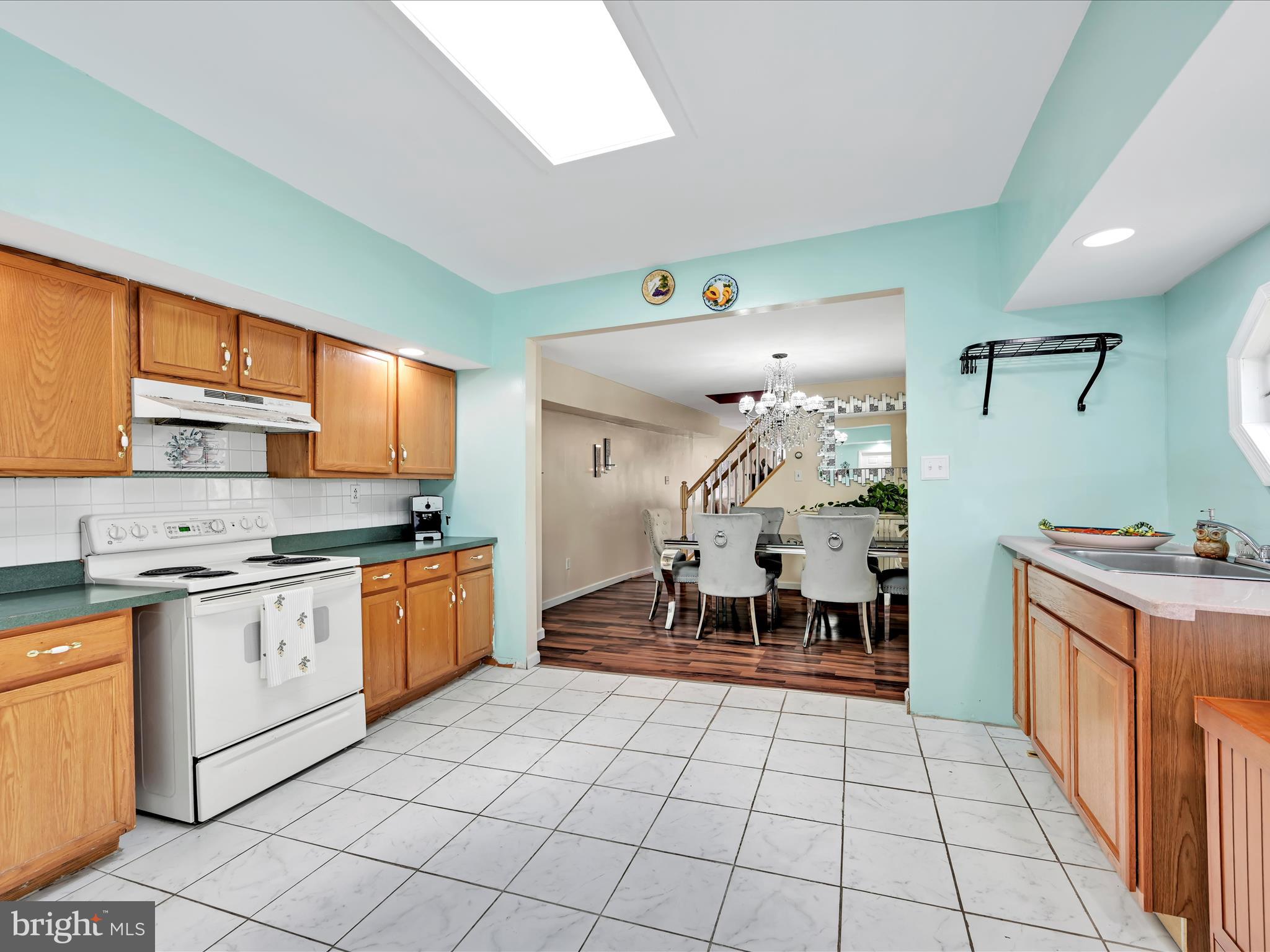 125 West Washington Street Shenandoah, PA 17976 - Photo 17 of 29 a kitchen with stainless steel appliances granite countertop a stove a sink and a refrigerator