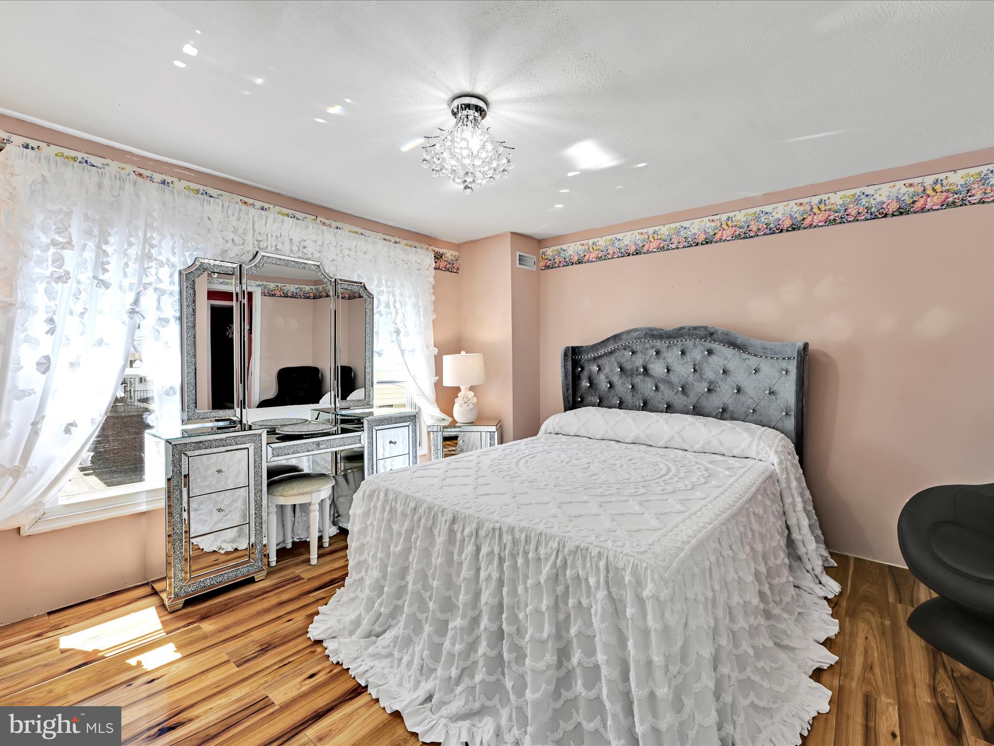 125 West Washington Street Shenandoah, PA 17976 - Photo 20 of 29 a bedroom with a bed and a flat screen tv