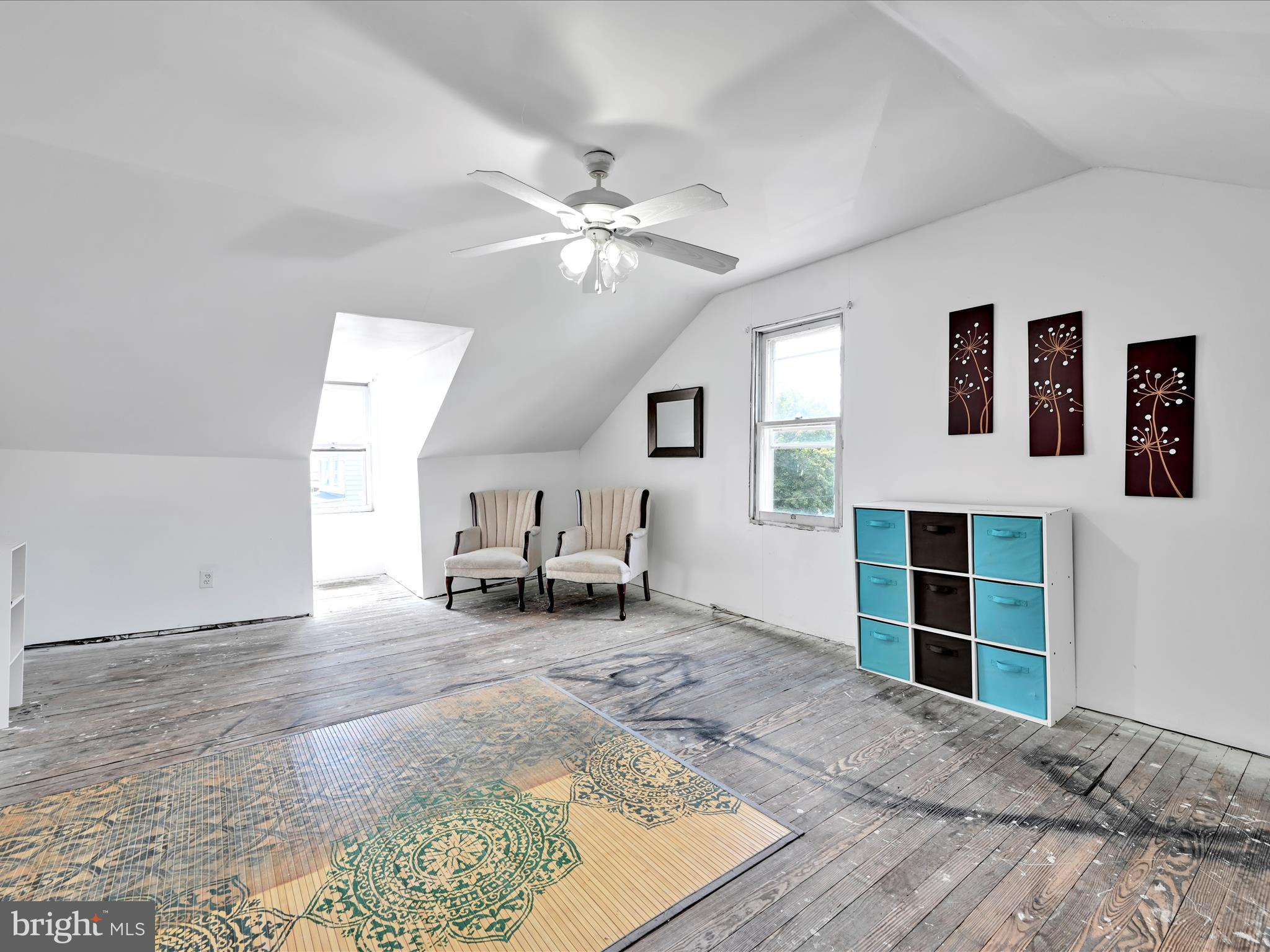 125 West Washington Street Shenandoah, PA 17976 - Photo 24 of 29 a view of a livingroom with furniture and a ceiling fan