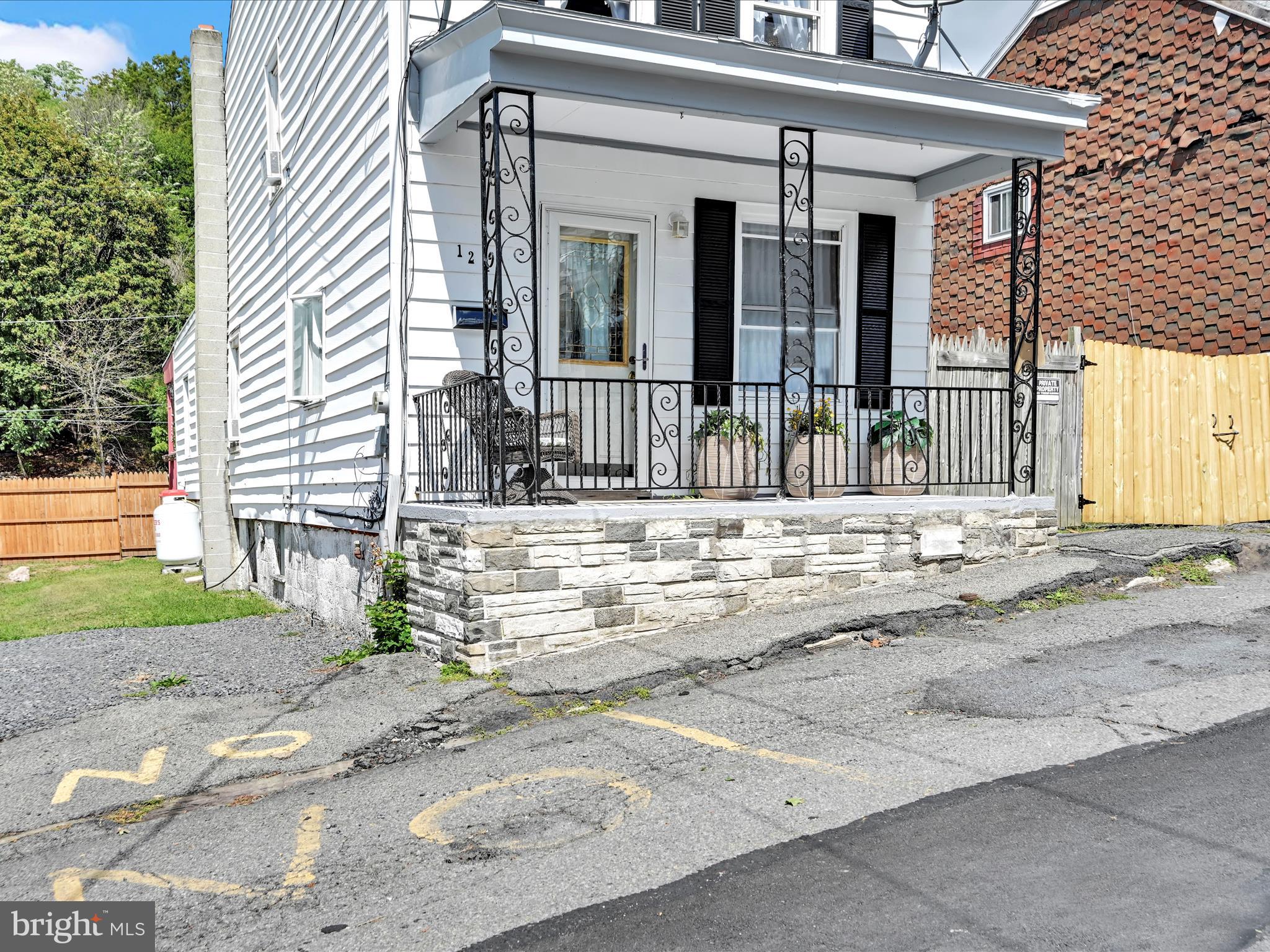 125 West Washington Street Shenandoah, PA 17976 - Photo 6 of 29 a view of a house with a small yard and plants