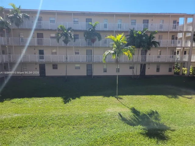a swimming pool with outdoor seating and yard