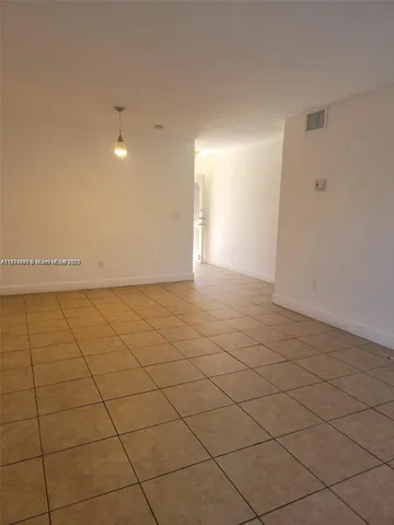 a view of living room with balcony and furniture