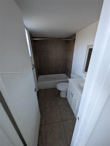 a view of a garden with a house