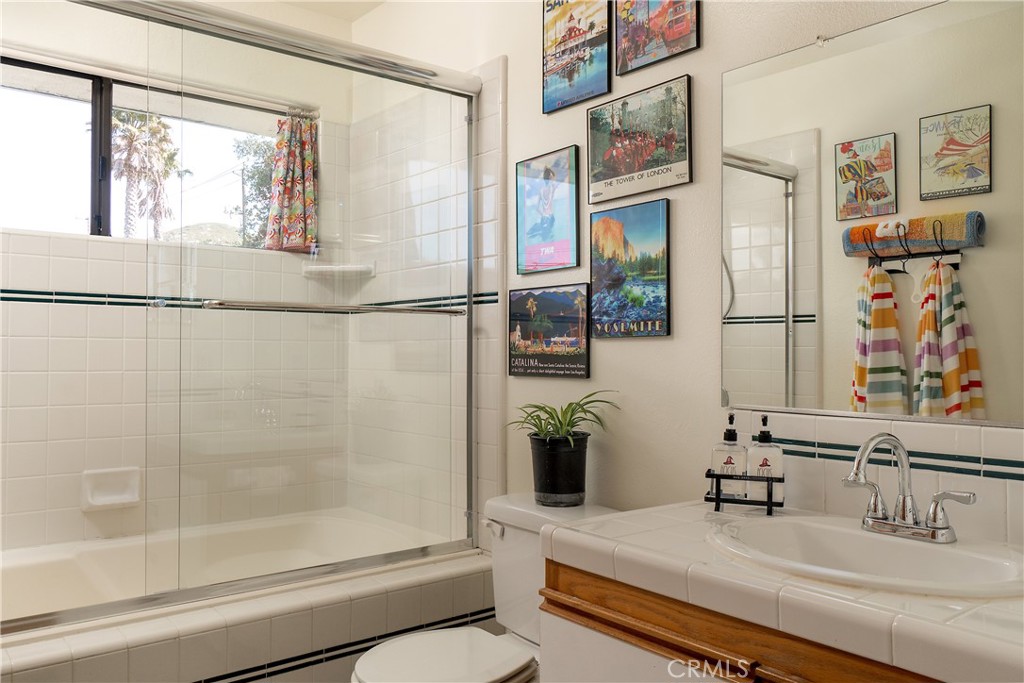 978 Balboa Street Morro Bay, CA 93442 - Photo 12 of 34 a bathroom with a sink and a shower