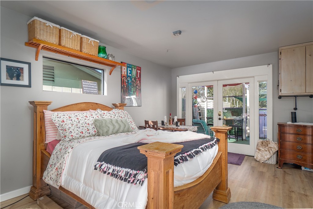 978 Balboa Street Morro Bay, CA 93442 - Photo 26 of 34 a bedroom with a bed and wooden floor