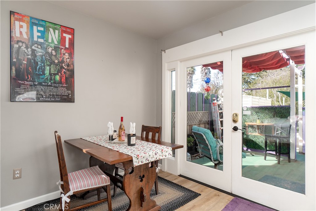 978 Balboa Street Morro Bay, CA 93442 - Photo 28 of 34 a view of a dining room with furniture wooden floor and a floor to ceiling window
