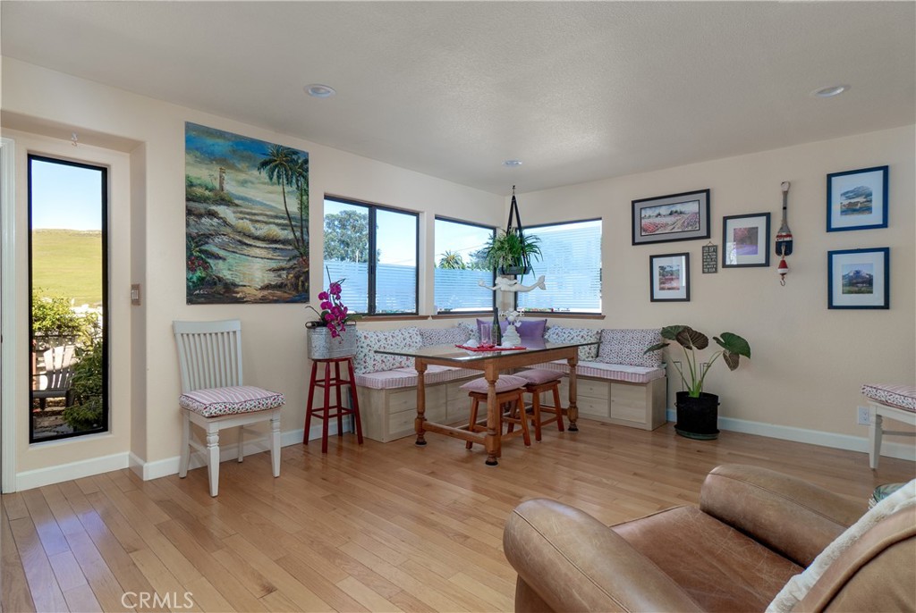 978 Balboa Street Morro Bay, CA 93442 - Photo 5 of 34 a living room with furniture a wooden floor and a table