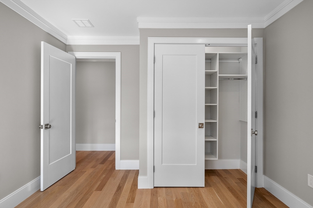 799 Heath Street, Unit 2 Brookline, MA 02467 - Photo 16 of 21 a view of empty room with wooden floor