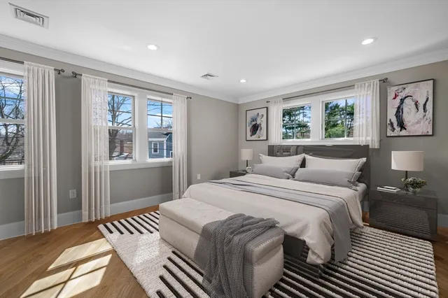 a bedroom with a large bed and a window