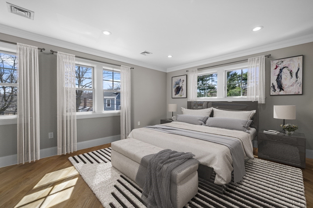 799 Heath Street, Unit 2 Brookline, MA 02467 - Photo 9 of 21 a bedroom with a large bed and a window