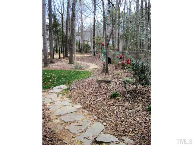 8508 Wheeling Drive Raleigh, NC 27615 - Photo 3 of 12 Flat lot with beautiful annuals throughout.