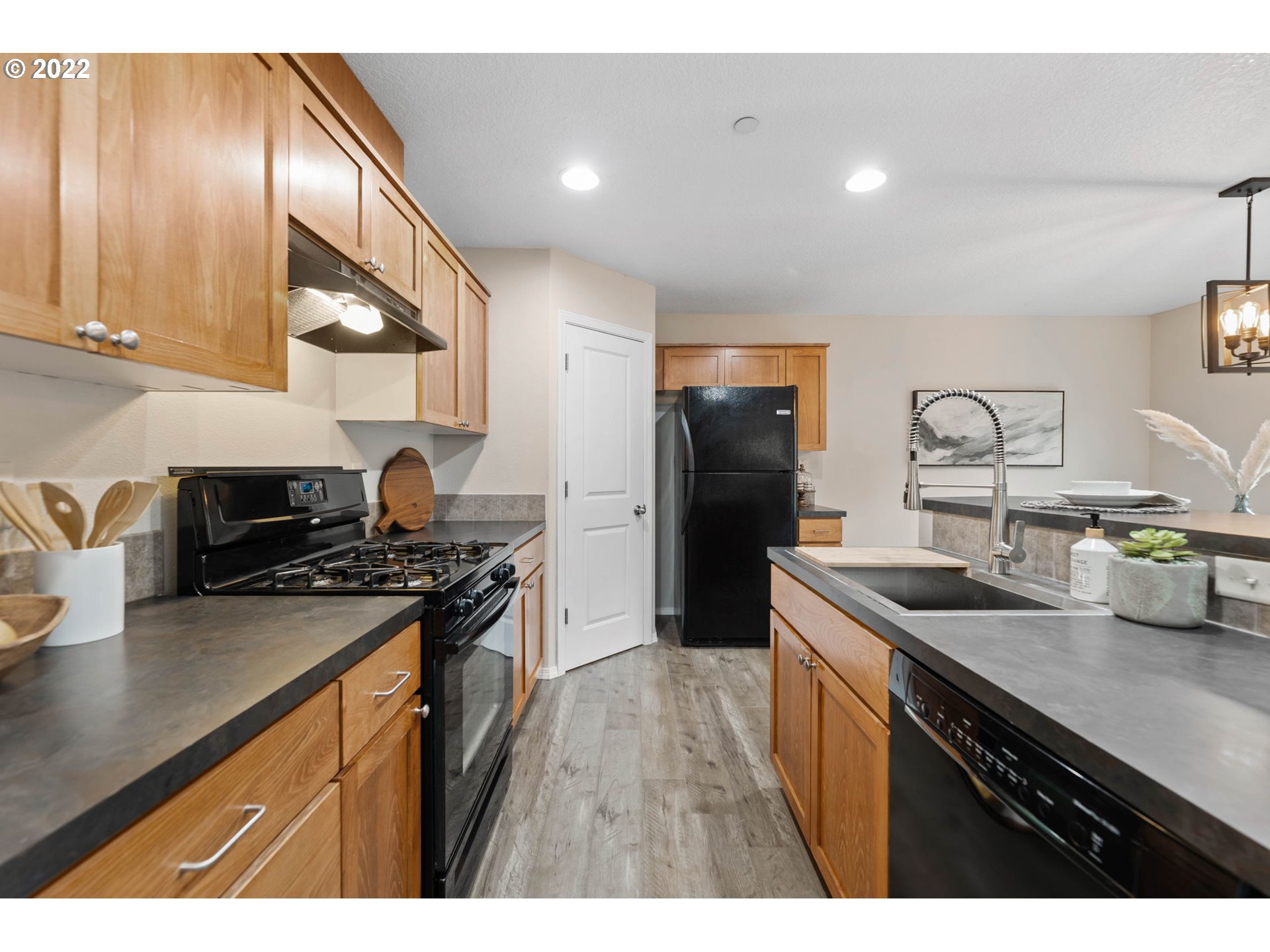 3301 Northwest 47th Drive Camas, WA 98607 - Photo 13 of 32 a kitchen with stainless steel appliances granite countertop a sink stove and refrigerator