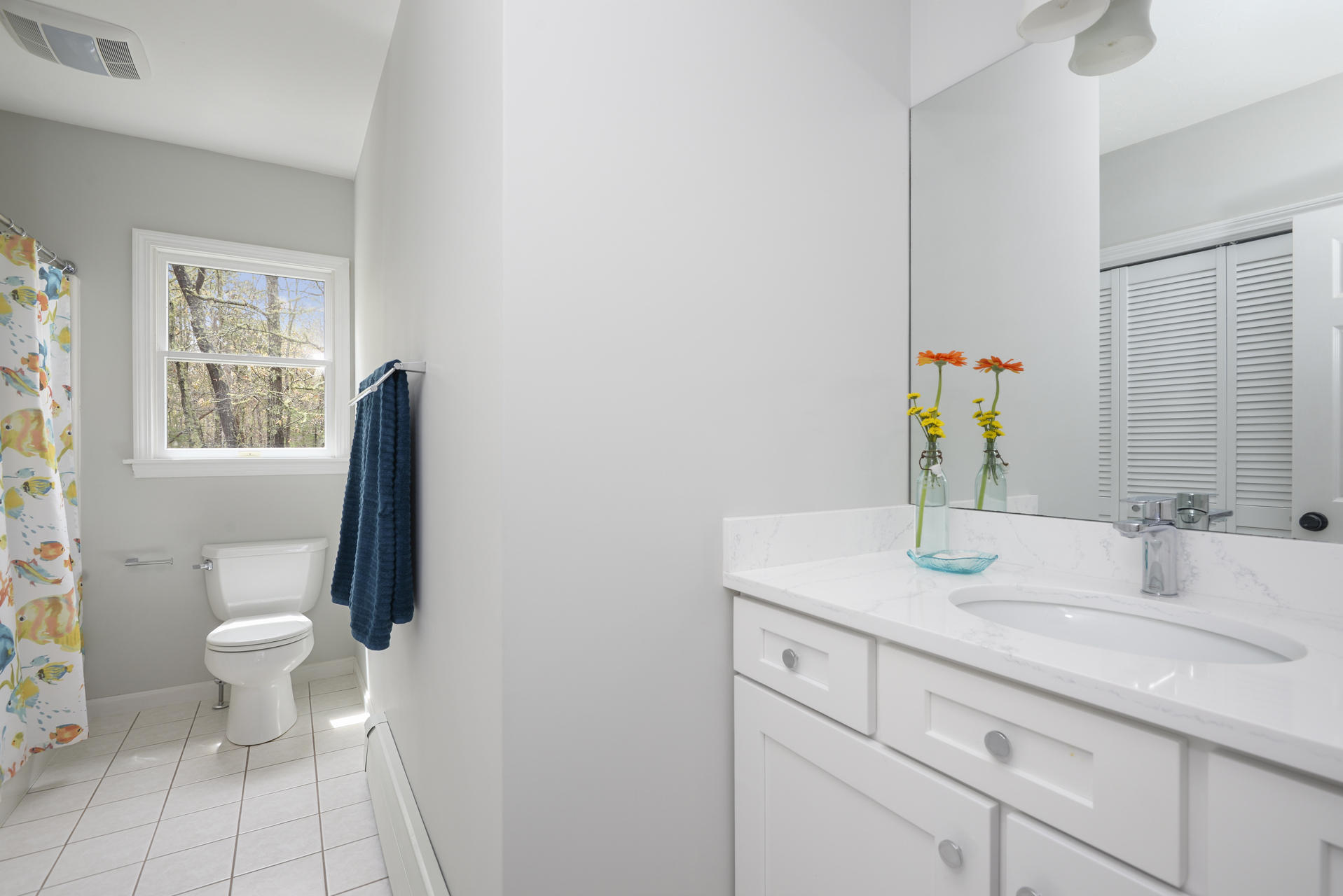 11 Quanset Road Orleans, MA 02653 - Photo 13 of 27 a bathroom with a sink toilet and vanity