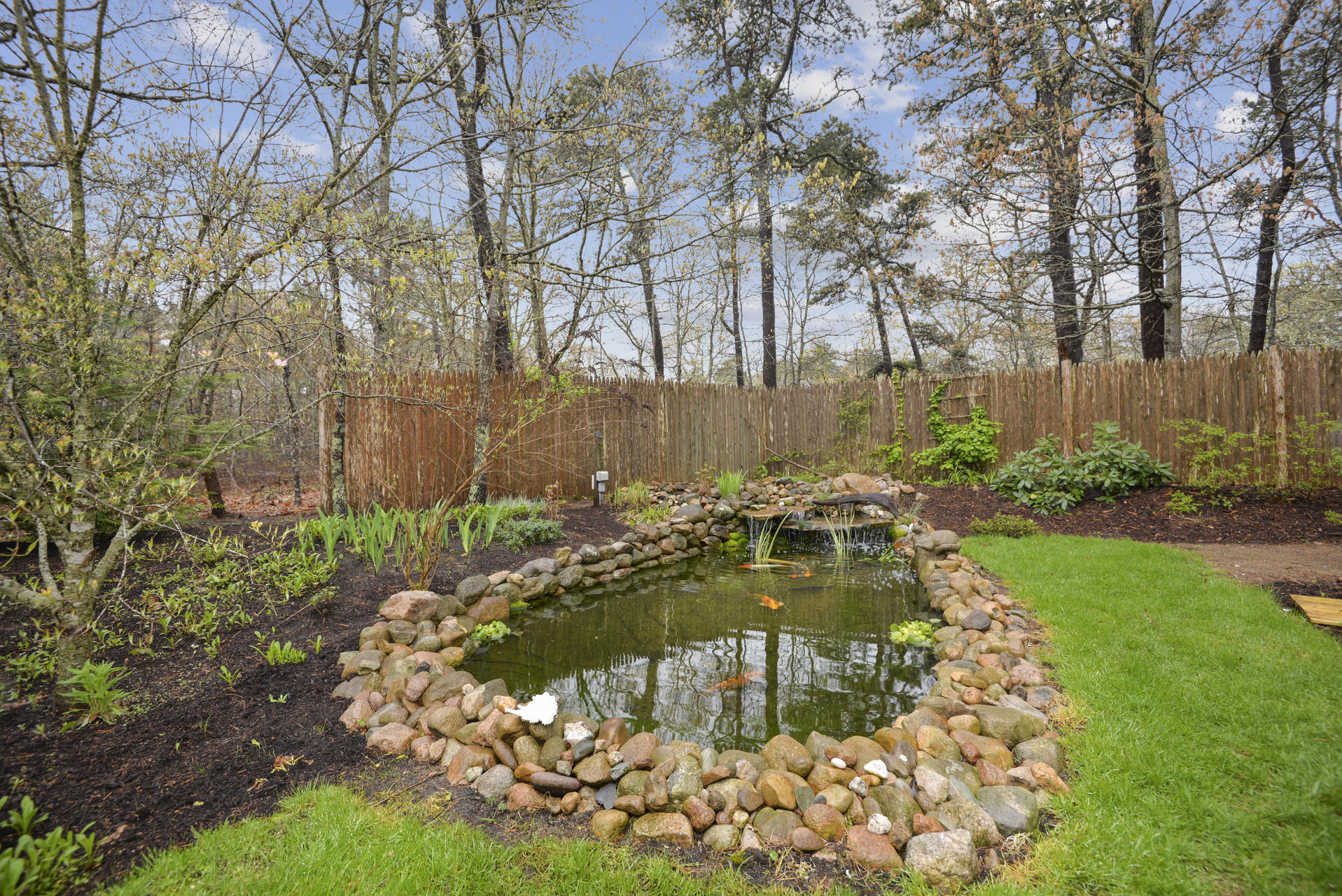 11 Quanset Road Orleans, MA 02653 - Photo 21 of 27 a view of a backyard with swimming pool