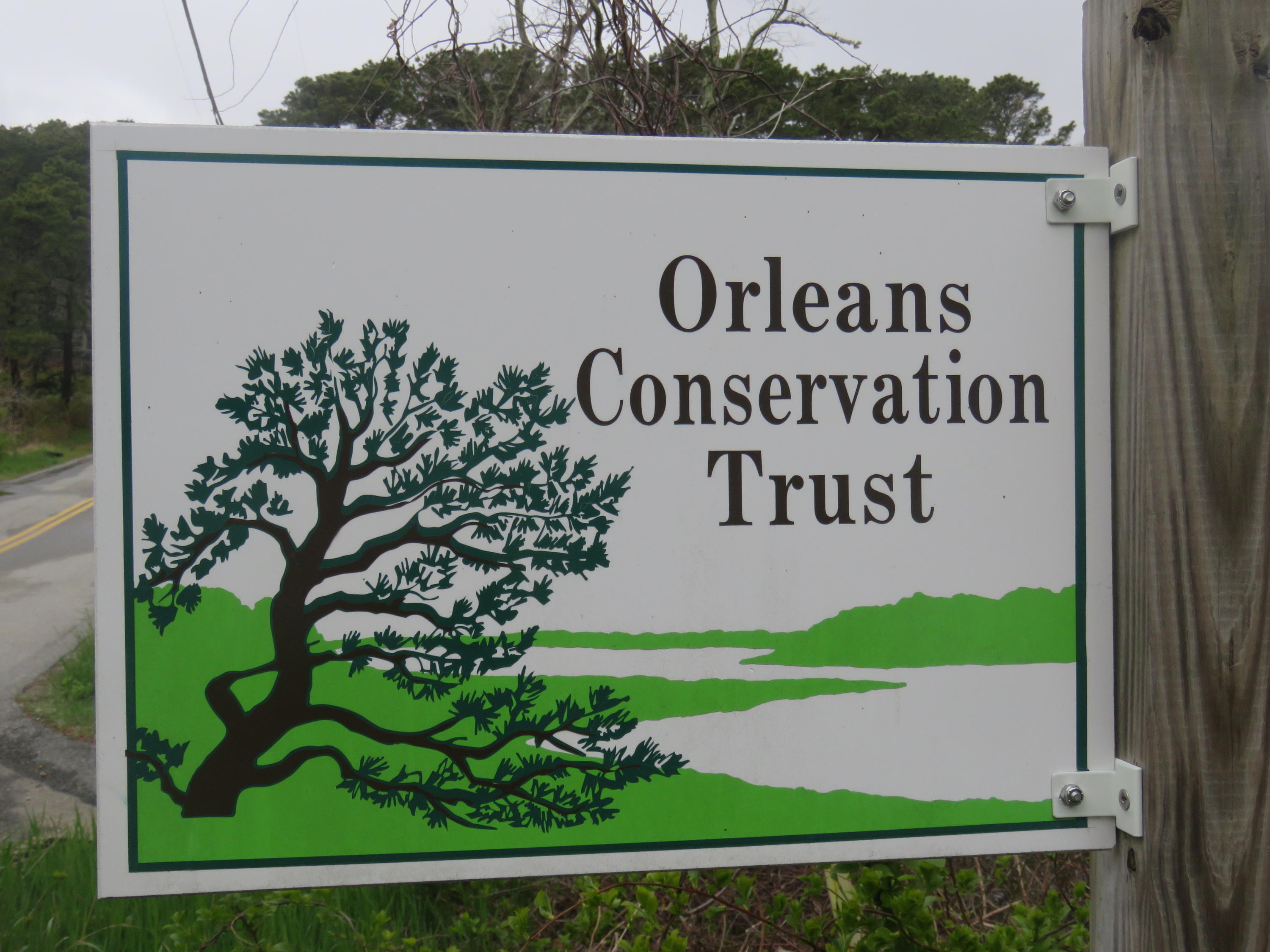 11 Quanset Road Orleans, MA 02653 - Photo 25 of 27 a view of outdoor space with signage and flags