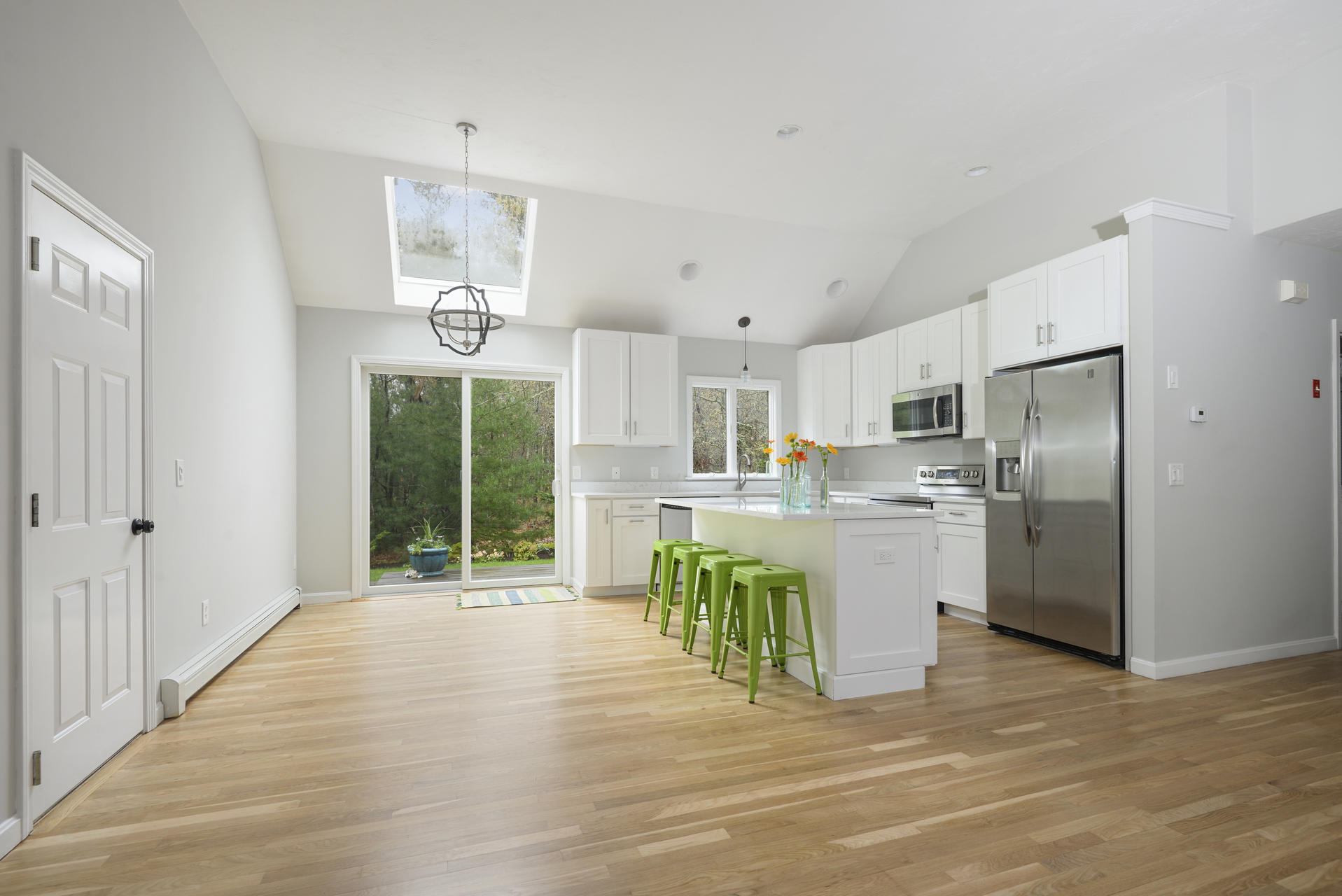 11 Quanset Road Orleans, MA 02653 - Photo 5 of 27 a open kitchen with granite countertop a refrigerator a stove top oven a sink and dishwasher