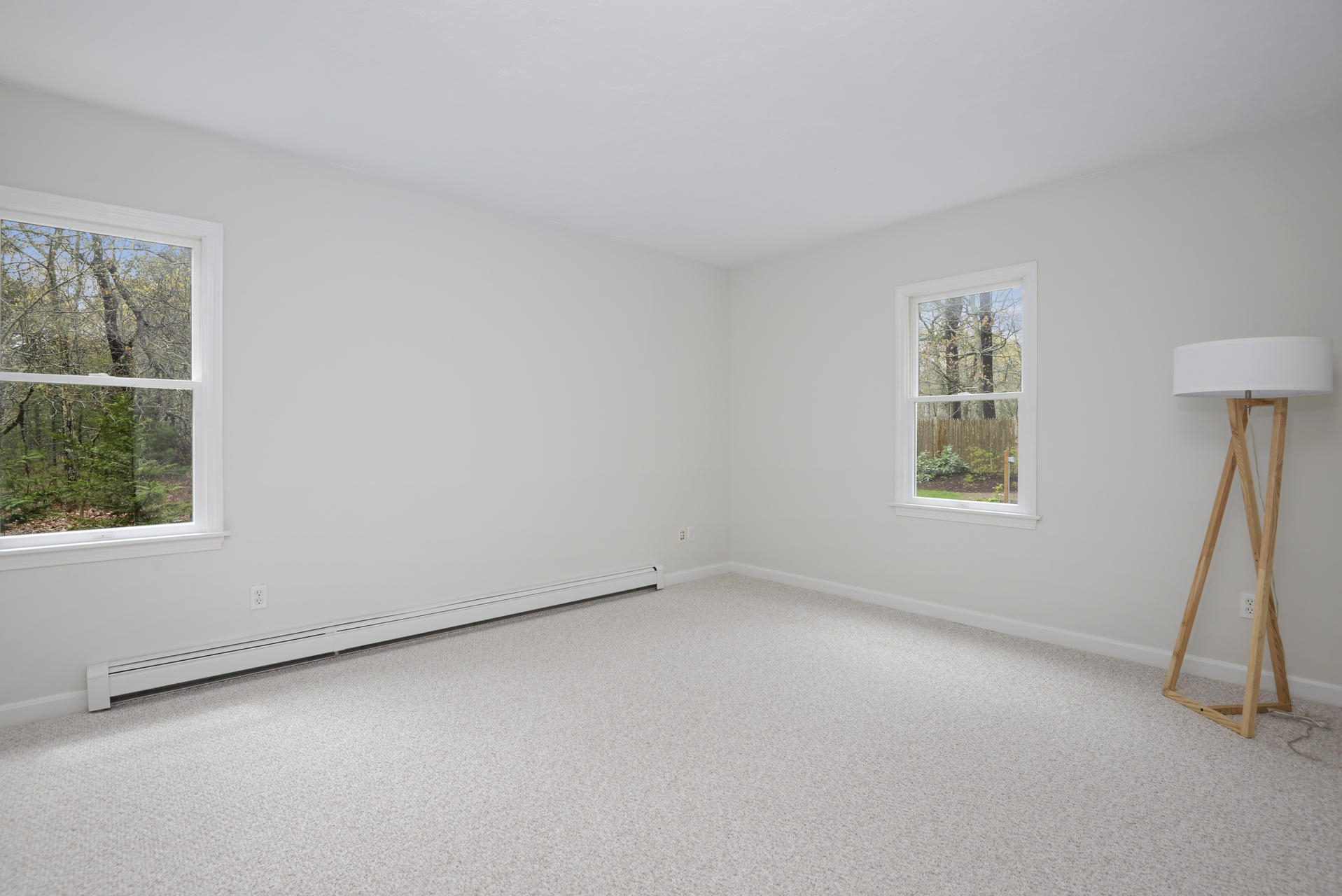 11 Quanset Road Orleans, MA 02653 - Photo 9 of 27 an empty room with a chair and a window