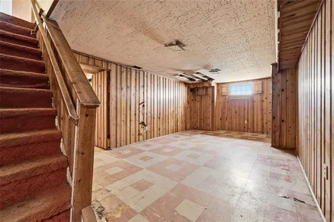 a view of an empty room with stairs