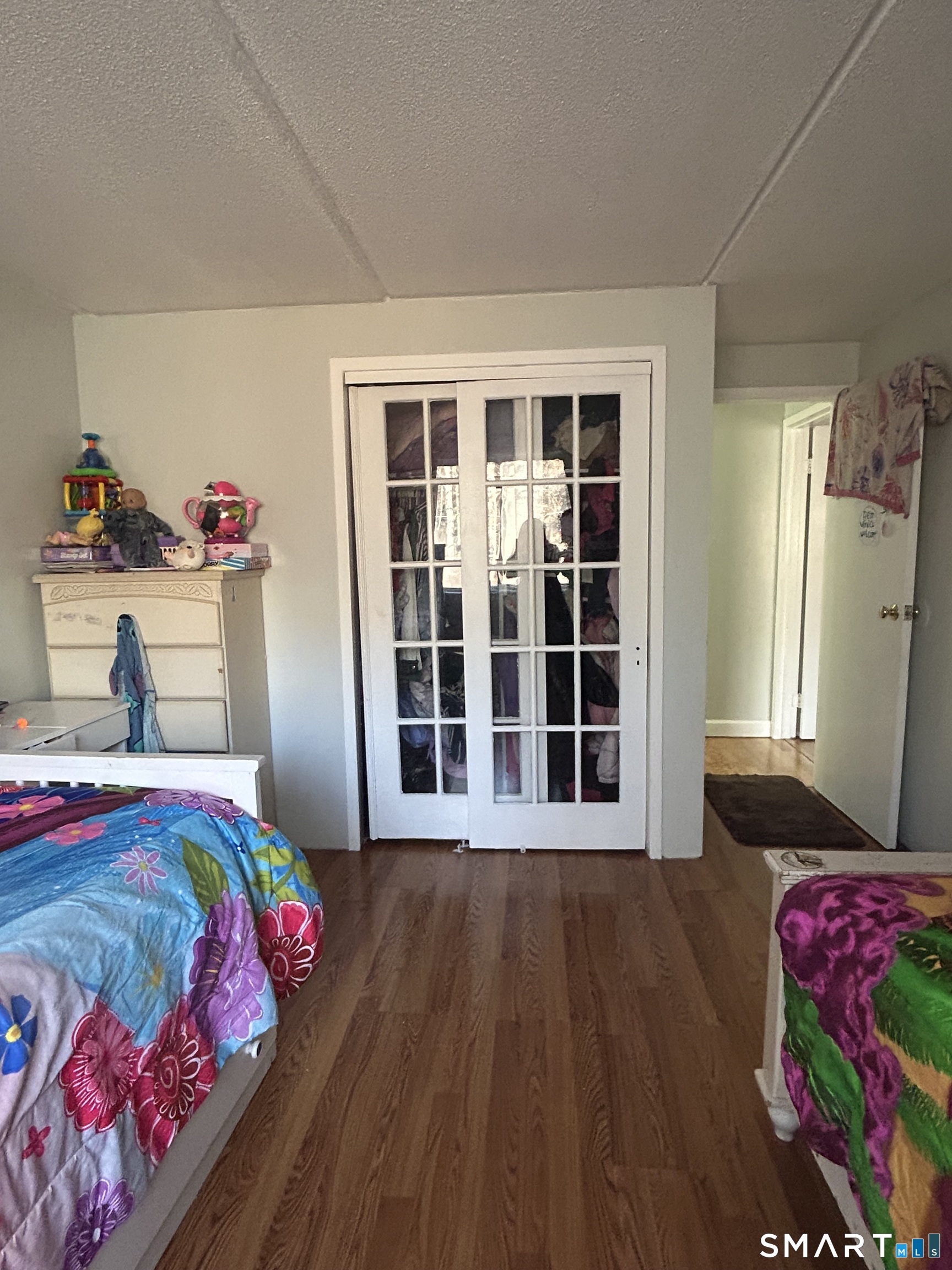 126 Triangle Street, Unit B13 Danbury, CT 06810 - Photo 11 of 20 a bedroom with a bed and a window