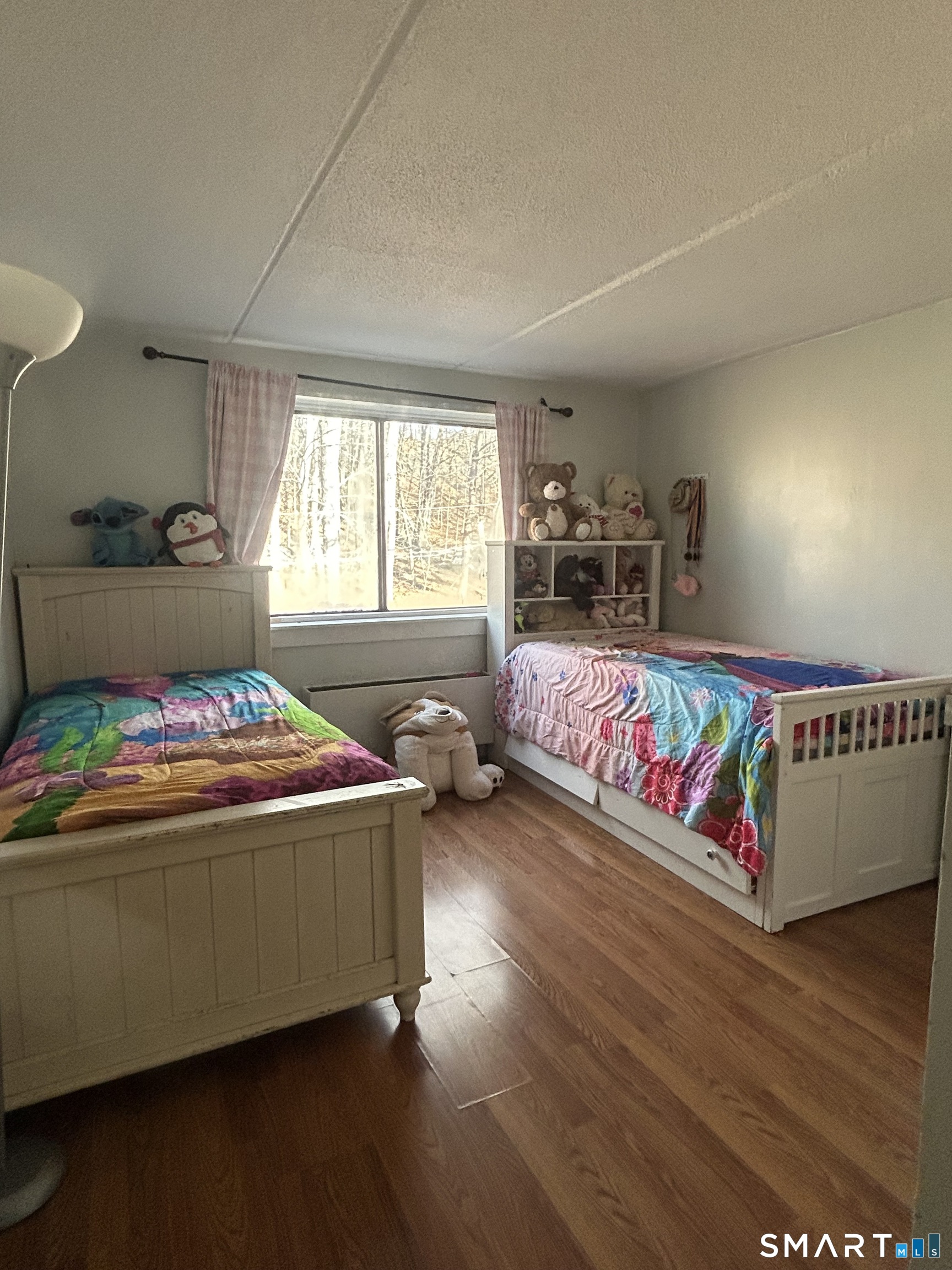126 Triangle Street, Unit B13 Danbury, CT 06810 - Photo 12 of 20 a living room with a couch and a table