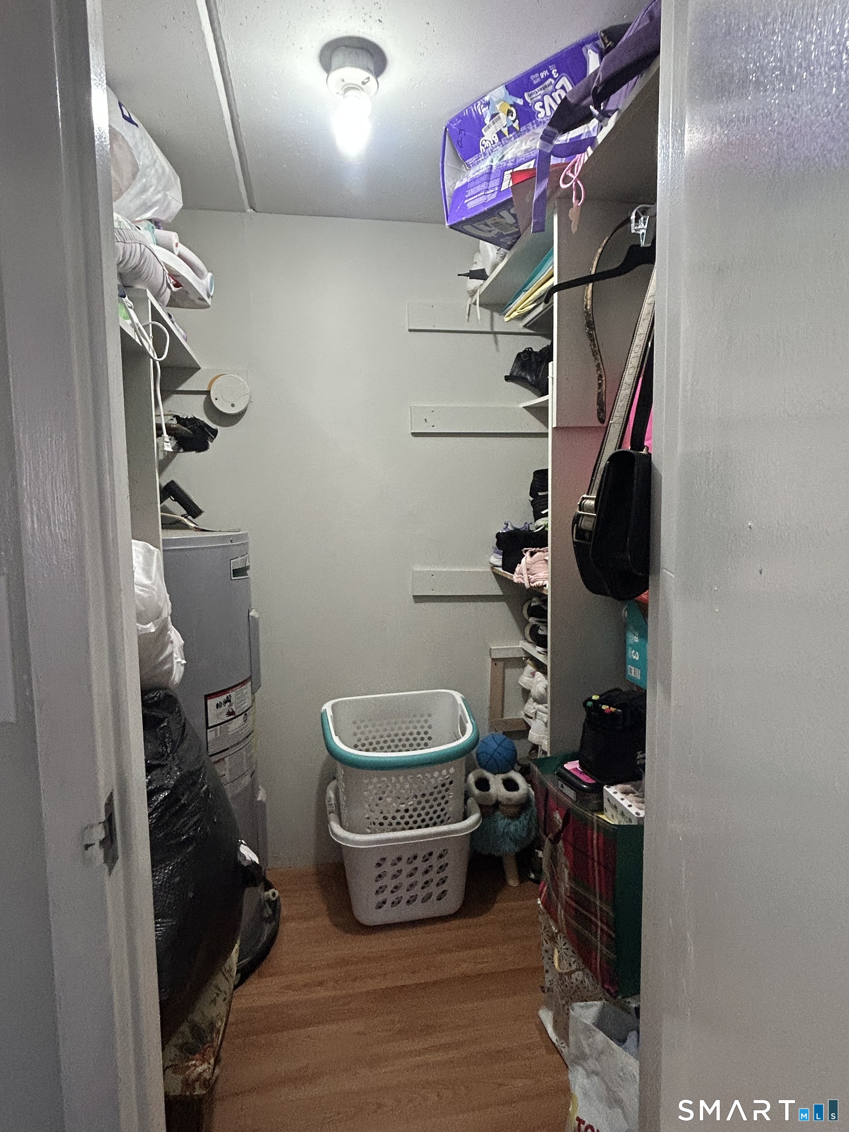 126 Triangle Street, Unit B13 Danbury, CT 06810 - Photo 18 of 20 walk in closet with wooden floor