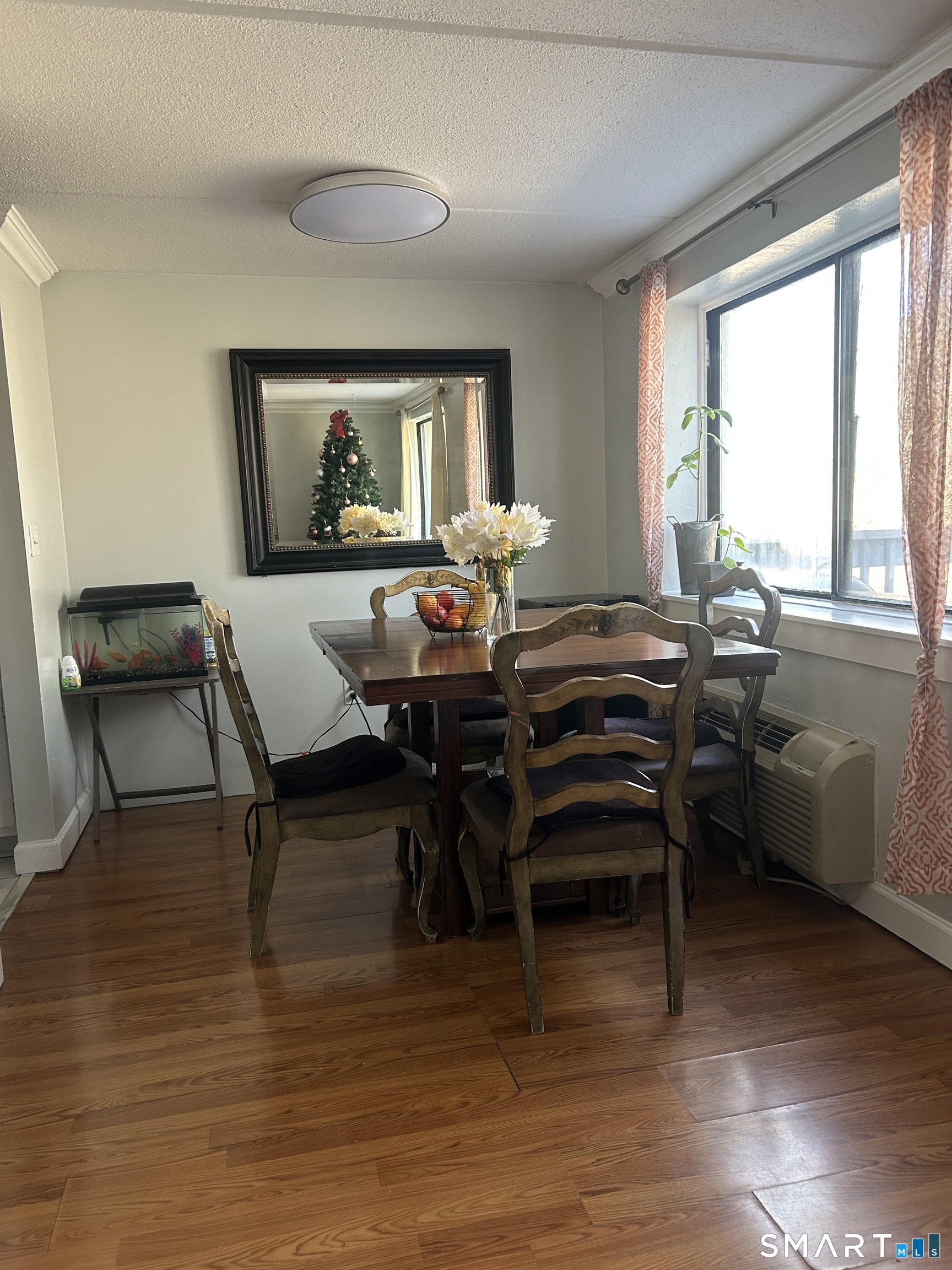 126 Triangle Street, Unit B13 Danbury, CT 06810 - Photo 5 of 20 a view of a dining room with furniture window and outside view