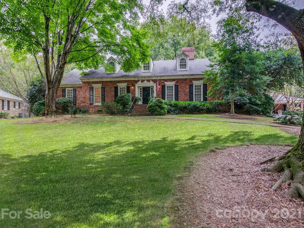 2930 Wickersham Road Charlotte, NC 28211 - Photo 1 of 25 a front view of a house with a garden