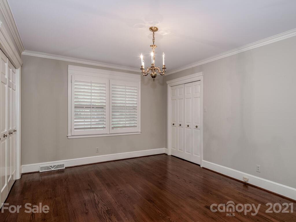 2930 Wickersham Road Charlotte, NC 28211 - Photo 14 of 25 a view of an empty room with wooden floor and a window