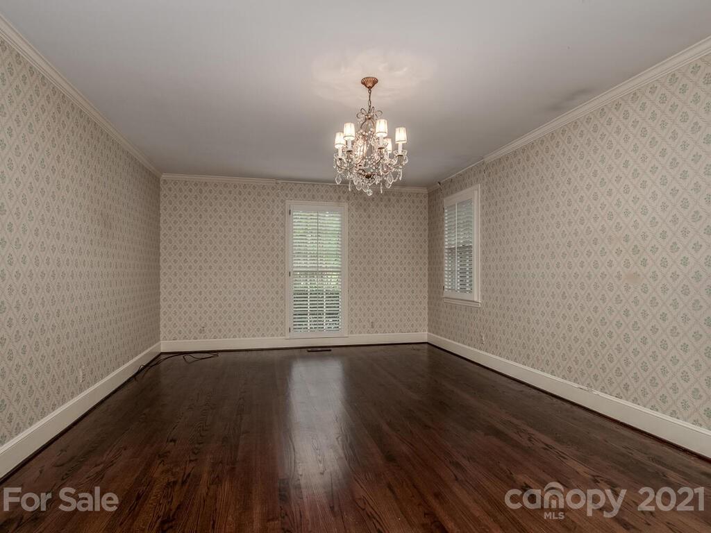 2930 Wickersham Road Charlotte, NC 28211 - Photo 18 of 25 a view of an empty room with wooden floor and a window