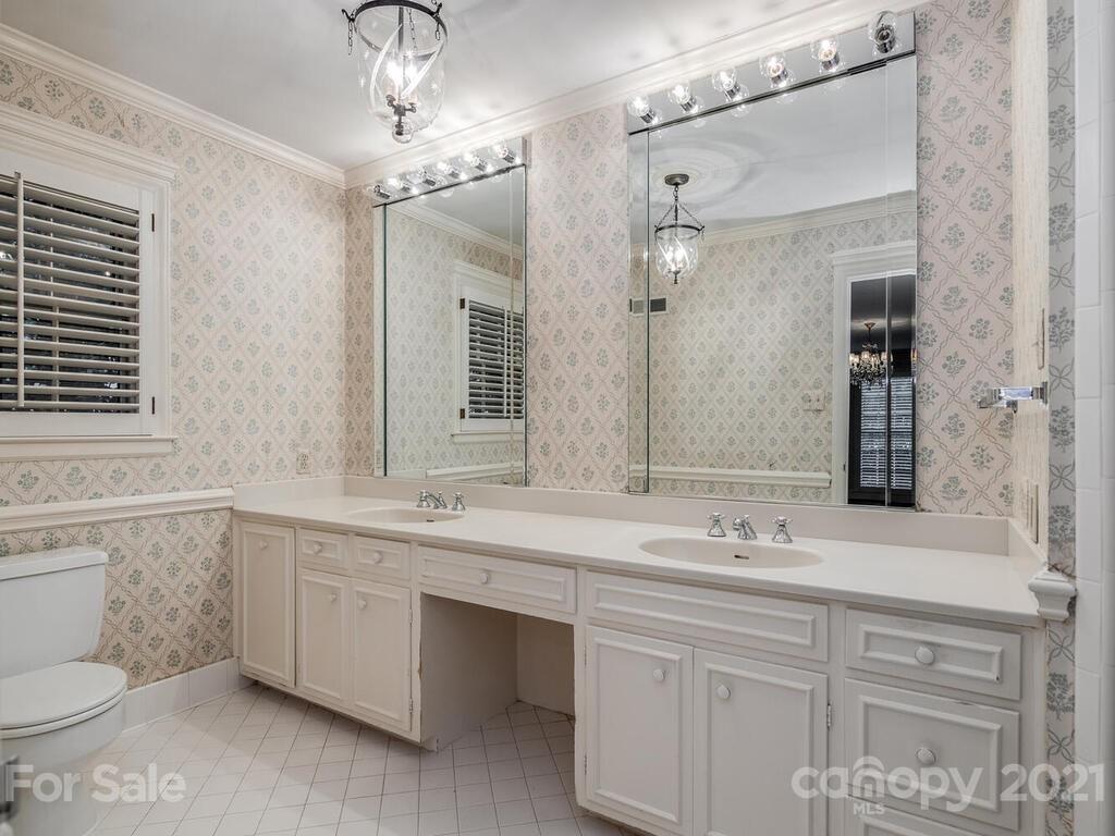 2930 Wickersham Road Charlotte, NC 28211 - Photo 20 of 25 a bathroom with a double vanity sink mirror and toilet