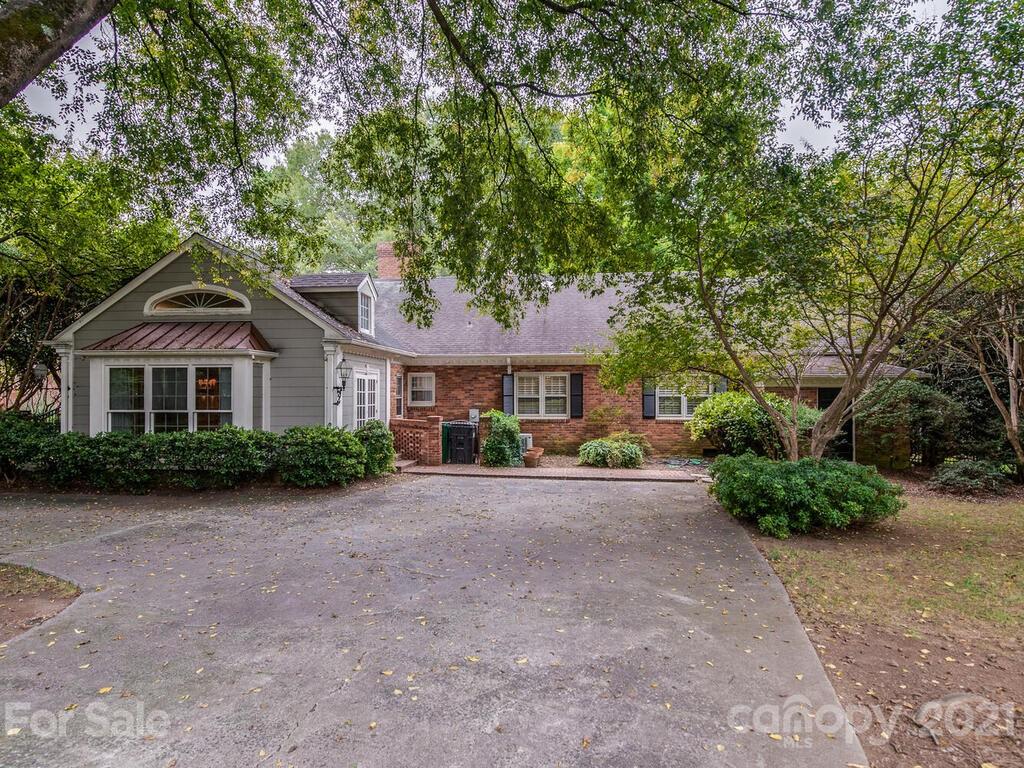 2930 Wickersham Road Charlotte, NC 28211 - Photo 21 of 25 a front view of a house with a garden