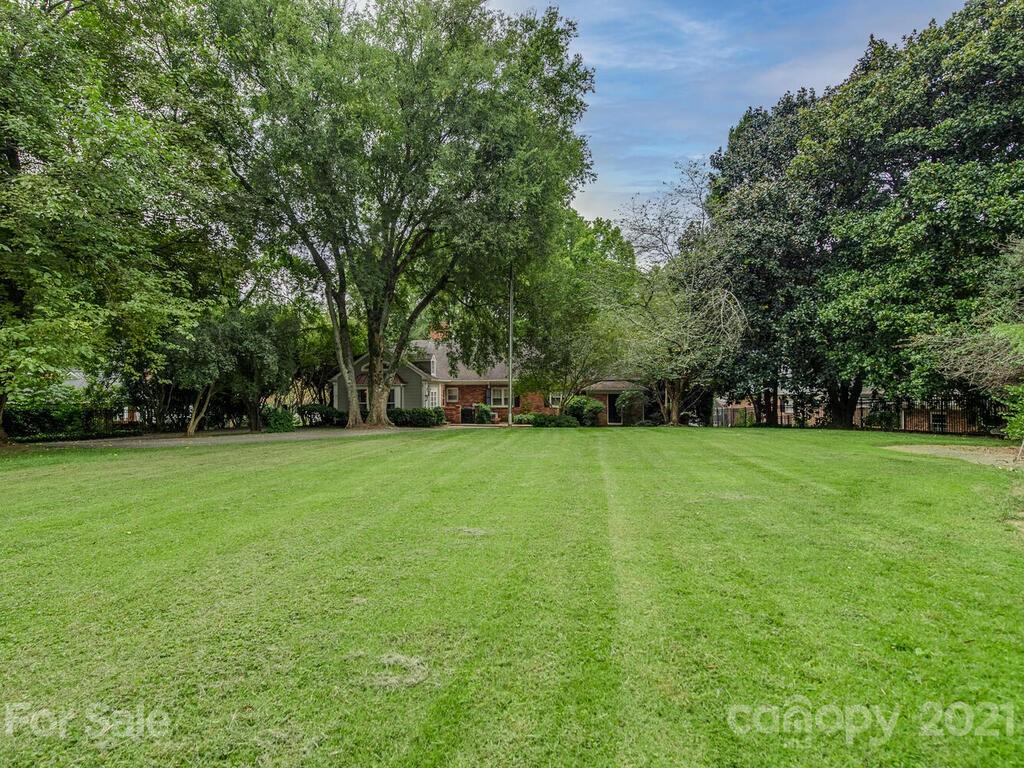 2930 Wickersham Road Charlotte, NC 28211 - Photo 24 of 25 a view of a field with trees in the background