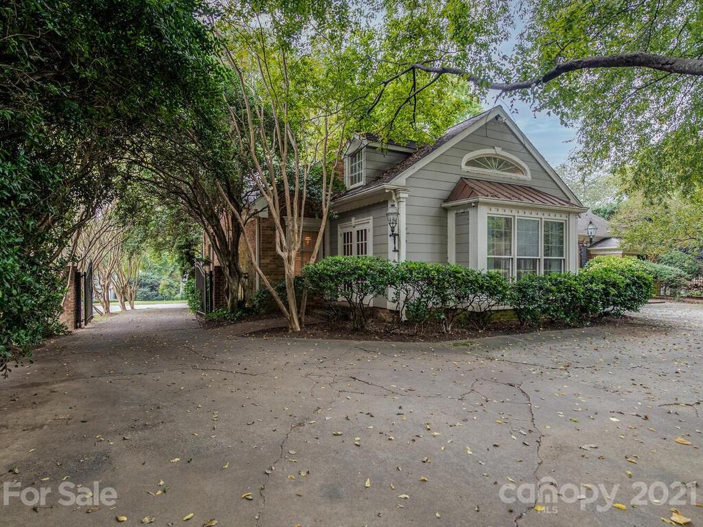 2930 Wickersham Road Charlotte, NC 28211 - Photo 25 of 25 a front view of a house with a garden