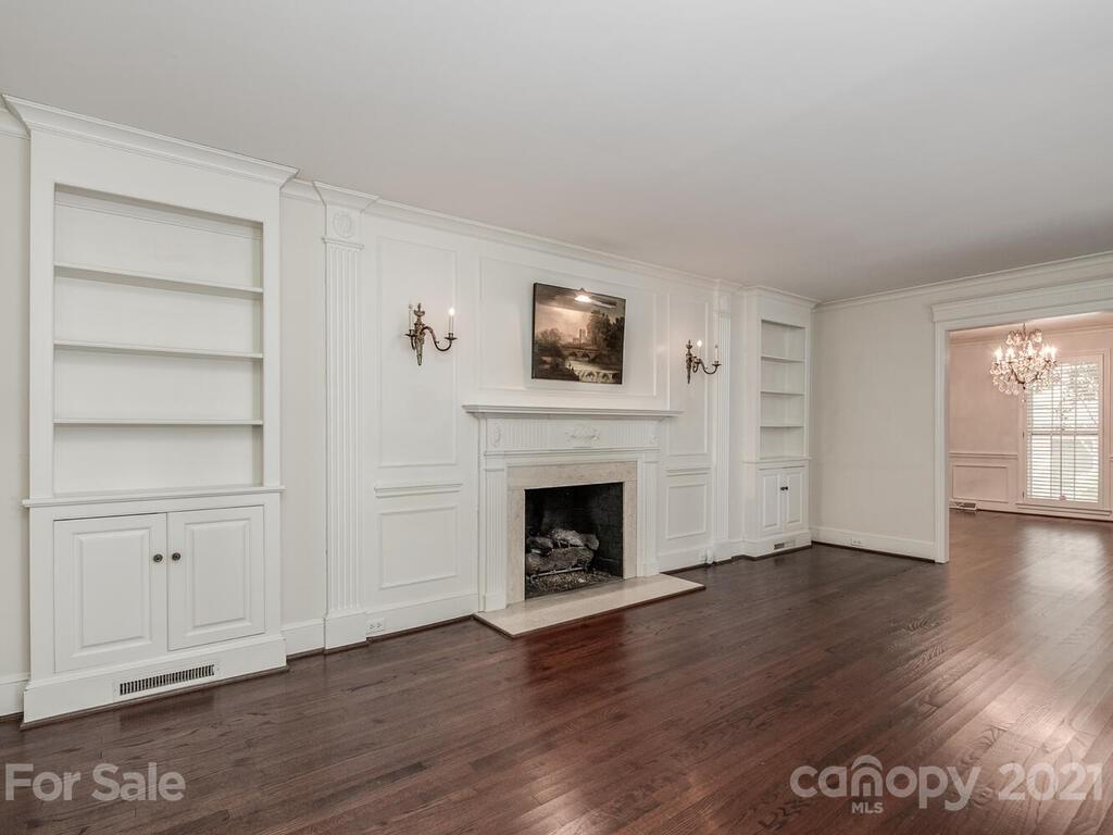 2930 Wickersham Road Charlotte, NC 28211 - Photo 4 of 25 a view of a livingroom with wooden floor and a fireplace