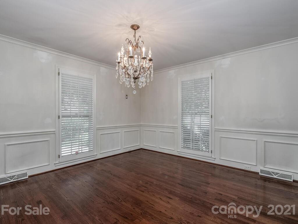 2930 Wickersham Road Charlotte, NC 28211 - Photo 5 of 25 a view of an empty room with wooden floor and a window