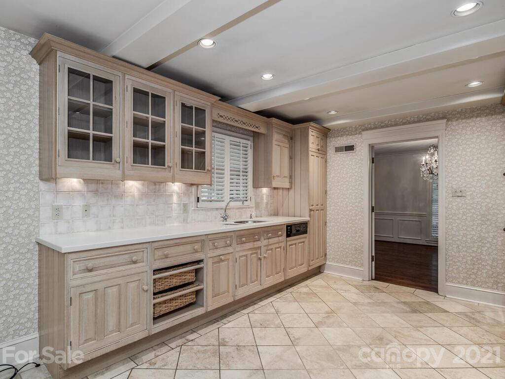 2930 Wickersham Road Charlotte, NC 28211 - Photo 6 of 25 a large kitchen with cabinets
