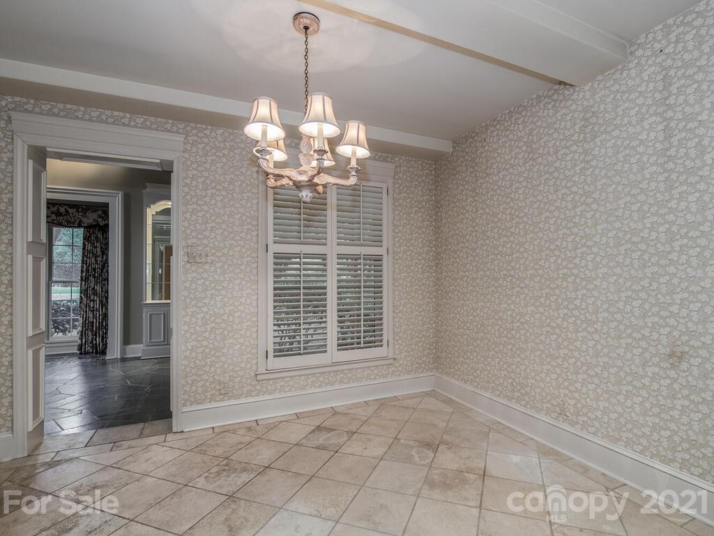 2930 Wickersham Road Charlotte, NC 28211 - Photo 9 of 25 a view of a livingroom with a chandelier windows and chandelier