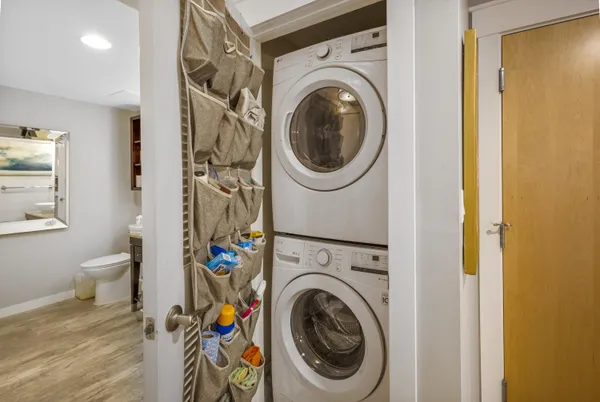 a view of a hallway with washer and dryer