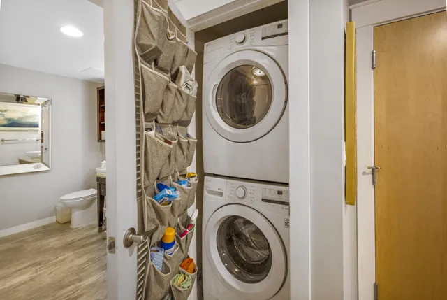a view of a hallway with washer and dryer