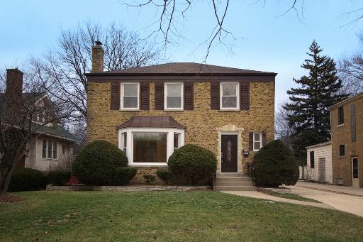 327 Bartram Road Riverside, IL 60546 - Photo 1 of 16 a front view of a house with a yard and garage
