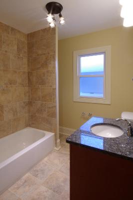 327 Bartram Road Riverside, IL 60546 - Photo 13 of 16 a bath room with a sink and a bath tub
