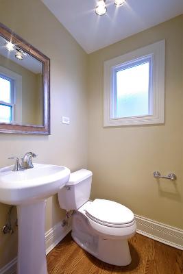 327 Bartram Road Riverside, IL 60546 - Photo 10 of 16 a bathroom with a toilet sink and mirror