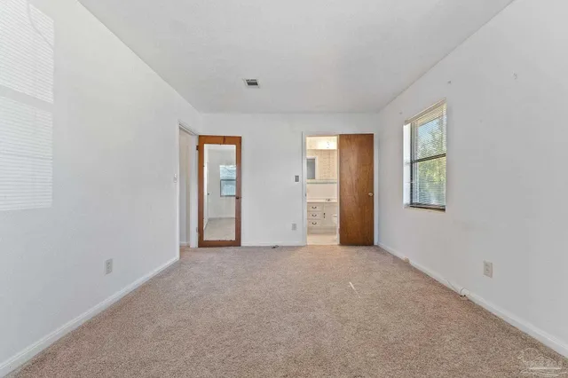 a bathroom with a sink a toilet and vanity