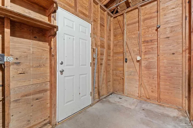 a view of a barn in the middle of a yard