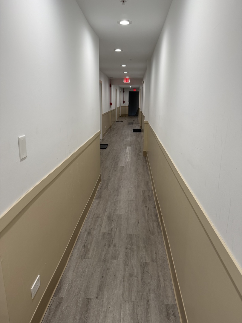 3239 Grove Avenue Berwyn, IL 60402 - Photo 12 of 16 a view of a hallway with wooden floor