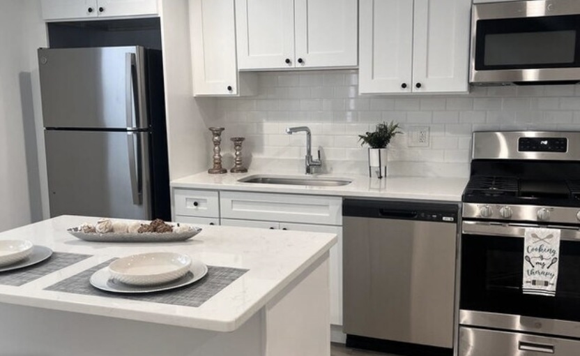 3239 Grove Avenue Berwyn, IL 60402 - Photo 9 of 16 a kitchen with granite countertop a sink stove and refrigerator