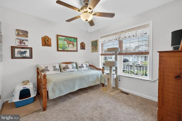 a kitchen with stainless steel appliances a refrigerator and a dining table