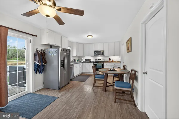 a kitchen with a sink appliances and cabinets