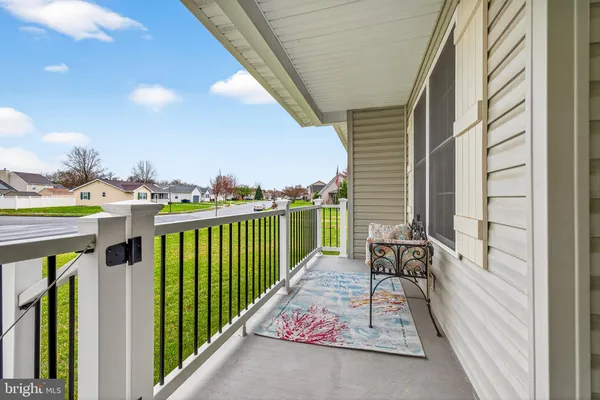 a view of a balcony with furniture